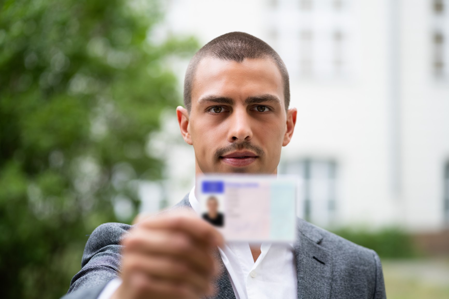 Bailiff Standing At Entrance Showing Id